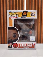 Front view of boxed Funko Pop #132 Chris Paul figure showing character and packaging details