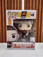 Front view of boxed Funko POP #148 Devin Booker figure