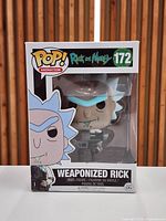 Front view of boxed Funko Pop! #172 Weaponized Rick