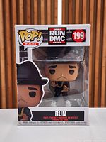Front view of Funko Pop Rocks #199 Run DMC Run figure in original box