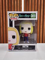 Front view of Funko Pop Beth #301 in sealed box