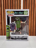 Front view of sealed Funko POP #332 Pickle Rick with Laser box