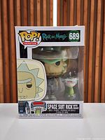 Front view of boxed Funko Pop #689 Space Suit Rick with Snake
