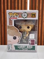 Front view of sealed Funko Pop Larry Bird box showing figure and labeling