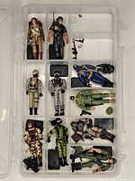 Full view of compartment case with all figures and accessories visible
