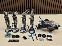 Overview of four assembled legs, loose elements and cockpit parts of LEGO Water Strider