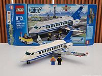 Assembled Lego City 3181 plane with box and three minifigures