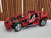 Left side view of assembled red Lego Technic 8448 car