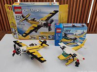 Overall view of both assembled airplanes with their boxes