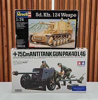 Box fronts of both model kits stacked: Revell Sd. Kfz. 124 Wespe 1:76 and Tamiya 7.5 cm Pak 40 L/46 1:35