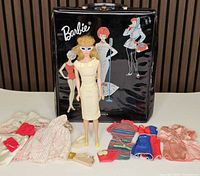 Overall lot: Barbie doll, case, assorted clothing and accessories displayed