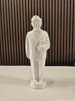 Front view of white Colonel Sanders plastic coin bank