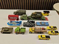 Group view of all fifteen diecast models on table