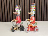 Both wind-up duck toys side by side for comparison