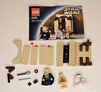 Full contents of LEGO 4475 set laid out with instruction booklet and pieces