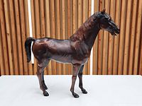 Left side view of brown Marx Thunderbolt horse figurine