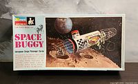 Box top showing Space Buggy artwork and Monogram branding