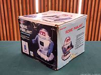 Outer cardboard box showing model imagery and wear