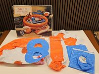 Overview of box and deflated vinyl components spread out