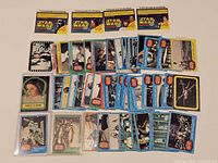 Overview of entire lot: trading cards, sticker cards and bubble gum wrappers laid out
