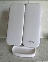 Mirror closed showing white front panels and Easehold logo