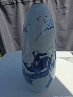 Side view showing riders on ox and birds motif