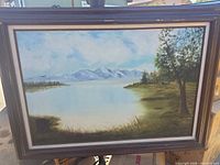 Framed oil painting showing full scene and frame