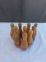 front angled view of ten wooden bowling pins