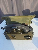 Front view of TA-312/PT telephone with handset seated and case flap open