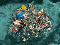 Full group of assorted rings spread on fabric