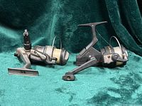 Both reels side by side on fabric backdrop