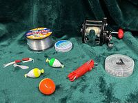 All items in lot arranged on green cloth