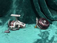 Both reels side by side on green cloth