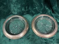 Top view of both ashtrays showing crystal bases and silver rims