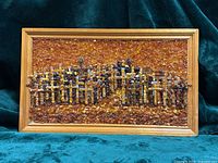 Full view of framed amber mosaic artwork