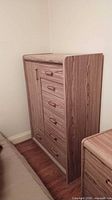 Front view showing door, drawers, and pulls