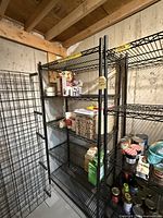Full view of assembled black wire shelving with five shelves