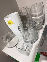 Group of assorted clear and white glass vases, bowls and candle holder