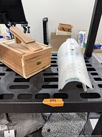 Cedar box and one boot shaper on metal cart