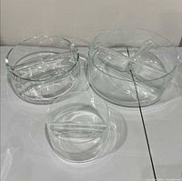 Front view of three clear glass divided bowls
