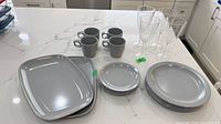 All dinnerware and drinkware grouped on countertop