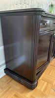 Side view of buffet showing mahogany finish and fluted corners