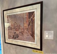 Front angled view of framed print hung on wall