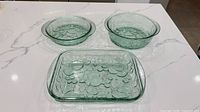 All three green depression glass dishes on countertop