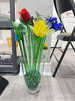Full arrangement showing vase, stems, and marbles