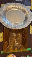Metal platter above, amber glass plate below