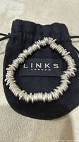 Bracelet on black Links of London pouch