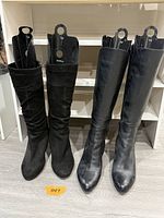 Front view both boot pairs on floor with inserts