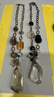 Full view of both glass bead opera necklaces