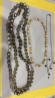 All three necklaces laid out together for overview